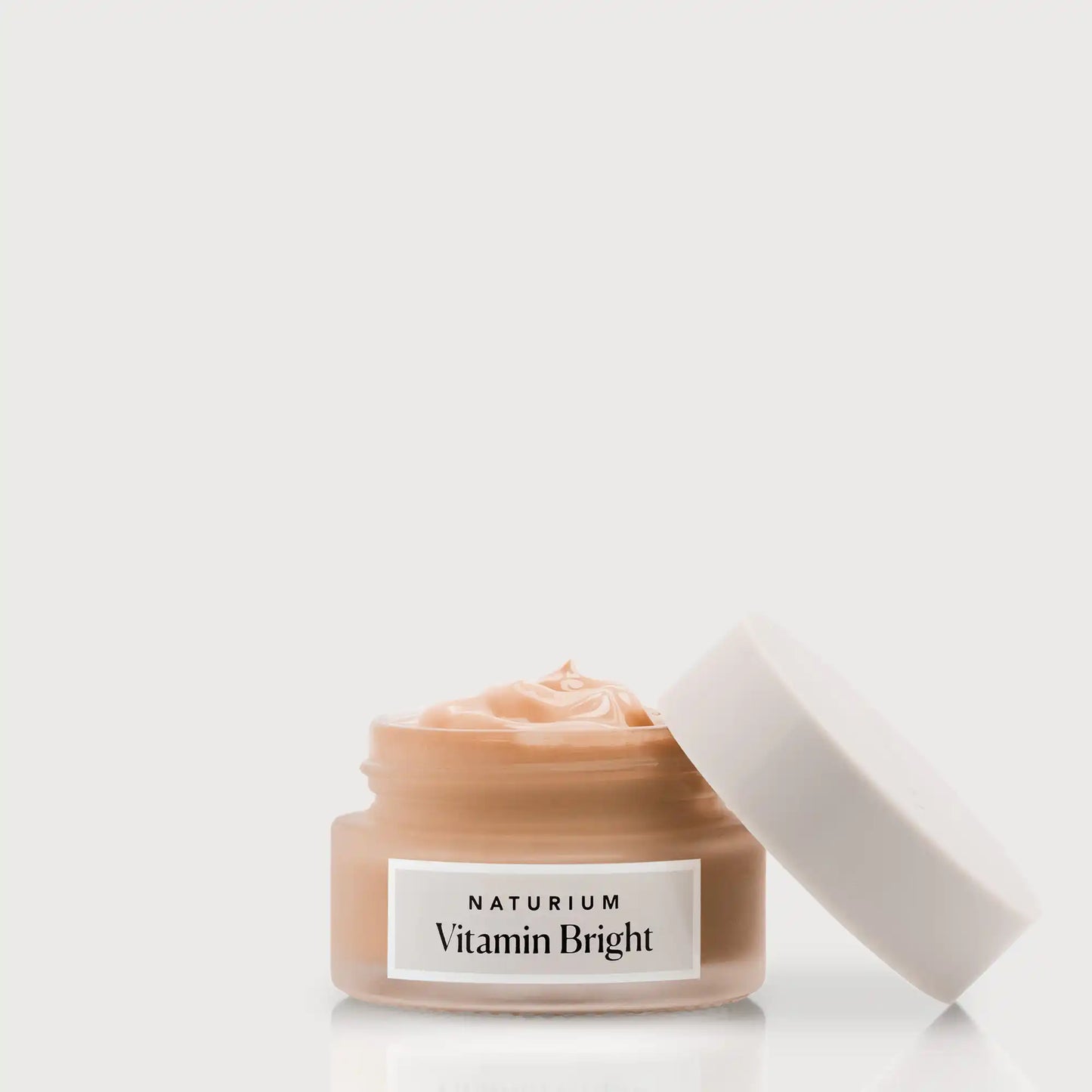 vitamin-bright-illuminating-eye-cream-t1 NATR-VitaminBright_DEEP_Primary_front_openjar_bone.webp